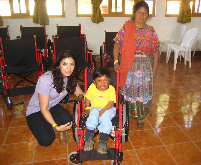 AG – Wheelchair Foundation Project 2010 – Maria O’malley with young boy with wheelchair